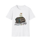 T-Shirt — 'Life Finds a Way' Daisy Rising from Rust Graphic Tee