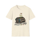T-Shirt — 'Life Finds a Way' Daisy Rising from Rust Graphic Tee